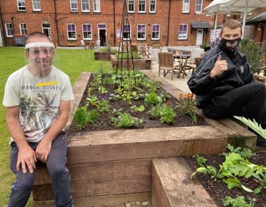 Service users design and plant new raised bed garden at Workbridge